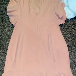 Never worn. Ruffled a bit on the shoulders and bottom. Tight on rest of body